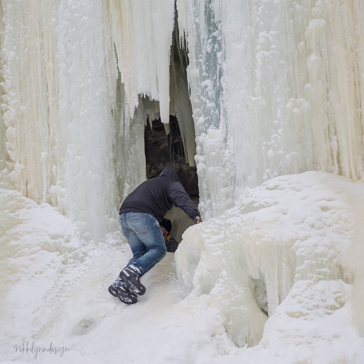 Visitors climbing into the Eben Ice Caves near Eben Junction in Upper Michigan