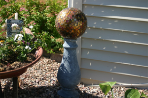 Broken Tile Gazing Ball - An old bowling ball left from the previous homeowner makes a nice piece of garden art. Bowling ball to broken tile gazing ball.