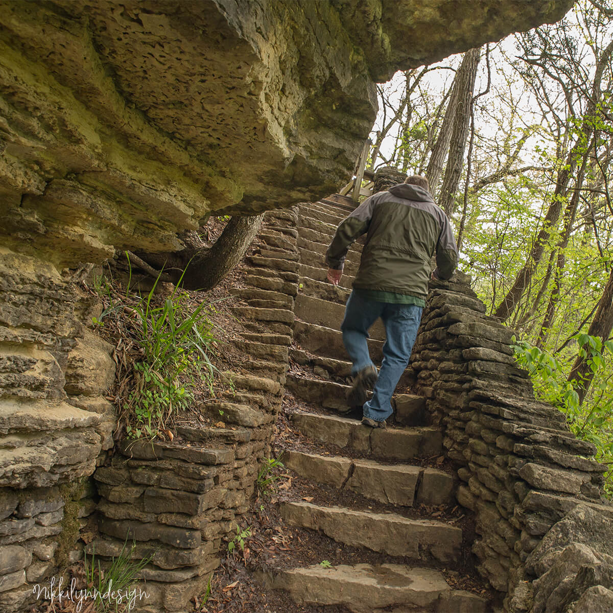 Stone stairs leading beneath a limestone cliff near Big Clifty Falls at Clifty Falls State Park in Madison Indiana