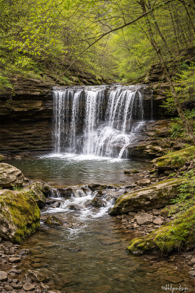 Lower Clifty Falls waterfall flowing over rock ledges in Clifty Falls State Park in Madison Indiana.
