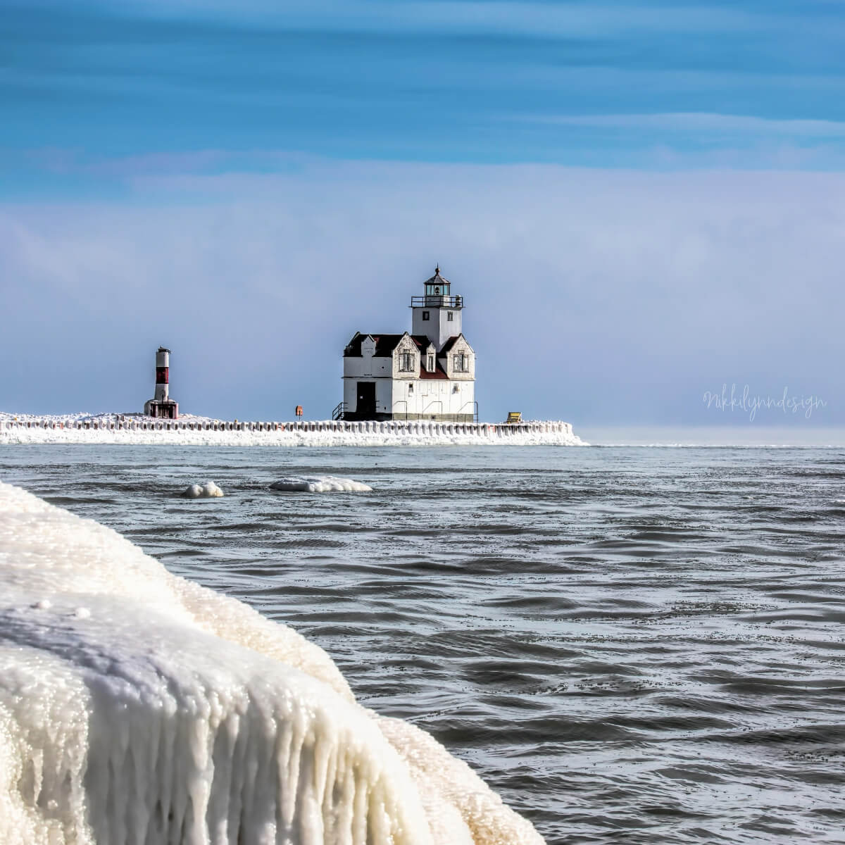 Kewaunee Wisconsin lighthouse covered in winter ice along the Lake Michigan shoreline