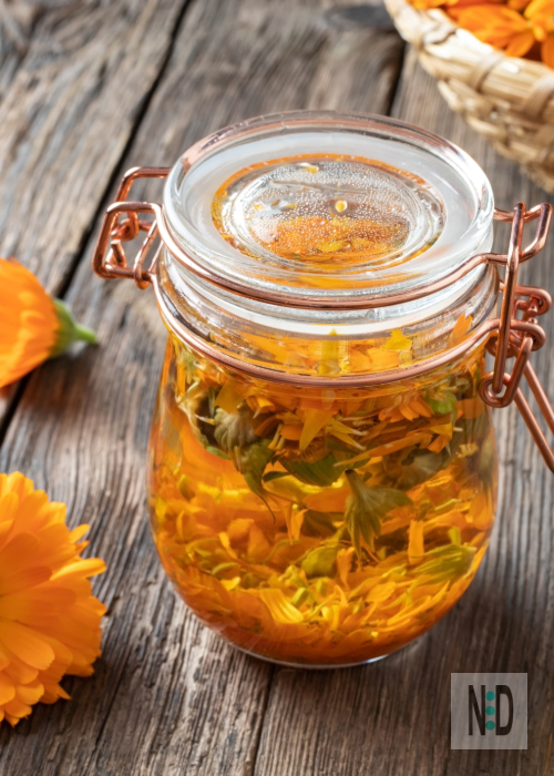 Every summer, I kick off what I fondly call my "kitchen window chemistry experiments." It's not fancy lab work—just me, a few jars, and the joy of infusing fresh or dried herbs into oils.

Right now, with July's long days stretching out, my counter is lined with jars of orange-hued Calendula flowers steeping in olive oil, catching the morning light. It's a ritual that feels like capturing a bit of sunshine for later use.