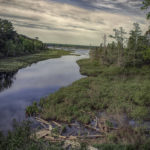 Lagoon on Madeline Island in Lake Superior with a boat in the foreground.