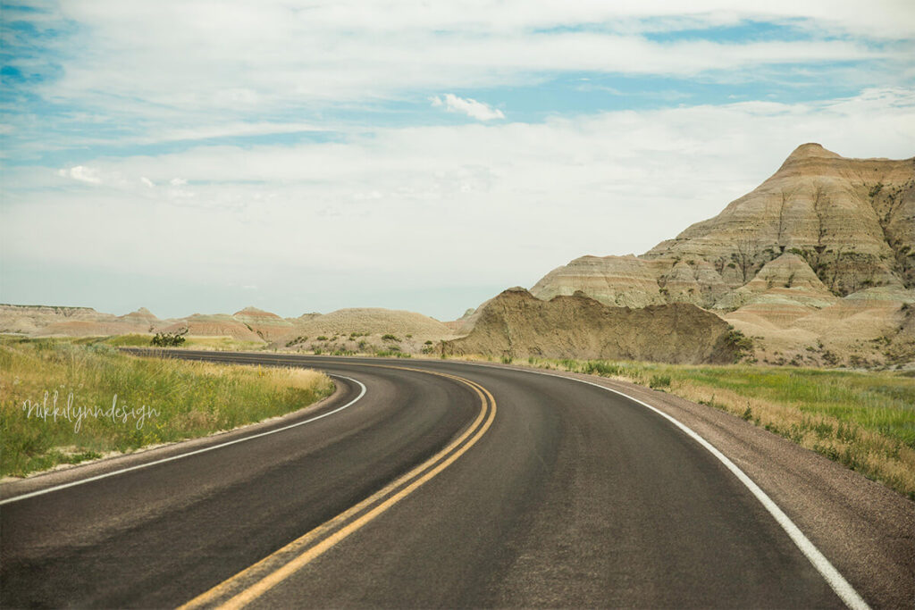 Badlands Loop Road winding through rock formations near the Pinnacles Entrance in Badlands National Park South Dakota